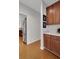 Walk-in pantry featuring wood floors, ample shelving, and convenient counter space at 226 Double Gate Ct, Sugar Hill, GA 30518