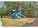 Blue playground structure featuring slides and climbing elements, set amidst trees, perfect for Gathering fun at 226 Double Gate Ct, Sugar Hill, GA 30518