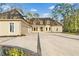 Elegant estate featuring a circular driveway and stately architecture at 1840 Brandon Hall Dr, Atlanta, GA 30350