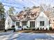 Stunning home with well-manicured lawn, mature landscaping, and a welcoming facade at 1840 Brandon Hall Dr, Atlanta, GA 30350