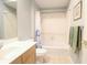 Bathroom features a full tub and shower combination with tiled floor and single sink at 225 E Ponce De Leon Ave # 317, Decatur, GA 30030