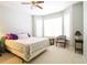 Bedroom featuring a ceiling fan, carpeted floor, and natural light from the large windows at 225 E Ponce De Leon Ave # 317, Decatur, GA 30030