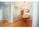 Elegant dining area featuring hardwood floors, natural light, and a seamless flow into the kitchen at 225 E Ponce De Leon Ave # 317, Decatur, GA 30030