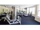 Well-equipped gym featuring modern exercise machines and abundant natural light from large windows at 225 E Ponce De Leon Ave # 317, Decatur, GA 30030