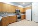 Well-equipped kitchen with stainless steel appliances, light countertops, and wood cabinetry at 225 E Ponce De Leon Ave # 317, Decatur, GA 30030