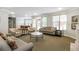 Spacious living room area featuring furniture and natural light from the windows at 225 E Ponce De Leon Ave # 317, Decatur, GA 30030
