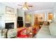 Bright living room features hardwood floors, fireplace, and an open layout leading to the dining area at 225 E Ponce De Leon Ave # 317, Decatur, GA 30030
