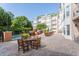 Relaxing pool area featuring outdoor seating, grilling stations, and lush greenery for residents at 225 E Ponce De Leon Ave # 317, Decatur, GA 30030