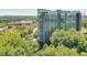 Modern high-rise nestled among lush greenery with a view of the city skyline at 3300 Windy Ridge Se Pkwy # 612, Atlanta, GA 30339