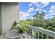 Charming balcony featuring a table and chairs, overlooking lush greenery and a clear blue sky at 3300 Windy Ridge Se Pkwy # 612, Atlanta, GA 30339