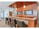 Modern bar area with stylish seating, a stone countertop and mounted televisions, creating an ideal social spot at 3300 Windy Ridge Se Pkwy # 612, Atlanta, GA 30339