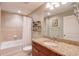 Bathroom with tile walls, granite countertop, and a bathtub with shower at 3300 Windy Ridge Se Pkwy # 612, Atlanta, GA 30339