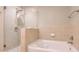 Spa-like bathroom features a glass enclosed shower with a rainfall showerhead and luxurious soaking tub at 3300 Windy Ridge Se Pkwy # 612, Atlanta, GA 30339
