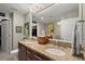 Bathroom featuring double sinks with granite countertop and well-lit vanity mirrors at 3300 Windy Ridge Se Pkwy # 612, Atlanta, GA 30339