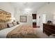 Comfortable bedroom with soft carpet, a king bed, and a glimpse of the en-suite bathroom with a wet bar at 3300 Windy Ridge Se Pkwy # 612, Atlanta, GA 30339