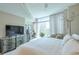 Serene bedroom with large windows, ample natural light, and modern decor at 3300 Windy Ridge Se Pkwy # 612, Atlanta, GA 30339