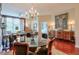 Elegant dining area features a chandelier, hardwood floors, and access to the living area at 3300 Windy Ridge Se Pkwy # 612, Atlanta, GA 30339