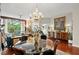 Bright dining area featuring a glass table and chairs next to the living area and a large window with treetop views at 3300 Windy Ridge Se Pkwy # 612, Atlanta, GA 30339