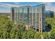 Stunning high-rise with glass facade, beautiful landscaping, and mature trees at 3300 Windy Ridge Se Pkwy # 612, Atlanta, GA 30339