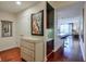 Spacious hallway with hardwood floors, decorative mirror, and an open view into the kitchen, living, and dining areas at 3300 Windy Ridge Se Pkwy # 612, Atlanta, GA 30339