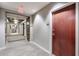 Neutral hallway outside apartment with wall to wall carpet and multiple doors leading to other apartments at 3300 Windy Ridge Se Pkwy # 612, Atlanta, GA 30339