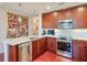 Modern kitchen with stainless steel appliances, pendant lighting, and a unique art piece at 3300 Windy Ridge Se Pkwy # 612, Atlanta, GA 30339