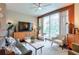 Cozy living room with large windows, stylish furniture, and modern decor with hardwood flooring at 3300 Windy Ridge Se Pkwy # 612, Atlanta, GA 30339