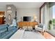 Comfortable living room with stylish furniture, hardwood floors, and a large sliding glass door at 3300 Windy Ridge Se Pkwy # 612, Atlanta, GA 30339