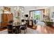Cozy living room featuring hardwood floors, elegant decor, and a balcony view at 3300 Windy Ridge Se Pkwy # 612, Atlanta, GA 30339