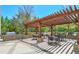 Covered patio with table and chairs, grill, pergola and manicured landscaping at 3300 Windy Ridge Se Pkwy # 612, Atlanta, GA 30339