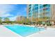 Inviting community swimming pool with lounge chairs surrounded by lush greenery at 3300 Windy Ridge Se Pkwy # 612, Atlanta, GA 30339