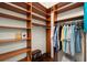 Spacious walk-in closet with custom wood shelving and rods for ample storage space at 3300 Windy Ridge Se Pkwy # 612, Atlanta, GA 30339