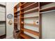 Walk-in closet with custom wood shelving and rods provides ample storage and organization at 3300 Windy Ridge Se Pkwy # 612, Atlanta, GA 30339