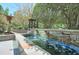Water feature surrounded by manicured landscaping and stone walls at 3300 Windy Ridge Se Pkwy # 612, Atlanta, GA 30339