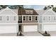 Charming townhome featuring a brick facade, attached garage, and neutral color palette at 6349 Towhee Way, Morrow, GA 30260