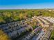 Community aerial view showcasing townhomes, mature trees, a playground, and proximity to the city at 2461 Bayrose Cir, Atlanta, GA 30344
