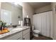 Clean bathroom showcasing a vanity with granite countertop and a shower with a curtain at 2461 Bayrose Cir, Atlanta, GA 30344