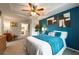Spacious bedroom boasts a tray ceiling, teal accent wall, and seating area at 2461 Bayrose Cir, Atlanta, GA 30344