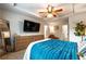 Bedroom featuring a tray ceiling and view into the en suite bathroom at 2461 Bayrose Cir, Atlanta, GA 30344