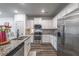 Sleek kitchen with stainless steel appliances and granite countertops, offering modern convenience at 2461 Bayrose Cir, Atlanta, GA 30344