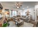 Comfortable living room featuring a neutral sectional sofa, a ceiling fan, and decor accents at 2461 Bayrose Cir, Atlanta, GA 30344