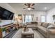 Cozy living room with a large sectional sofa, ceiling fan, and a decorative rug at 2461 Bayrose Cir, Atlanta, GA 30344
