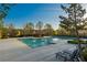 Community pool area with lounge chairs and a pergola for shade, perfect for relaxing and enjoying the outdoors at 2461 Bayrose Cir, Atlanta, GA 30344