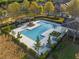 Aerial view of the large community pool, featuring a pergola, lounge area, and manicured landscaping at 2461 Bayrose Cir, Atlanta, GA 30344
