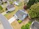 Aerial view of house with a car on the driveway, green backyard and dark roof at 3227 Grove Trl, Acworth, GA 30101