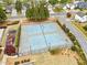 Aerial view of playground, tennis courts, and green foliage at 3227 Grove Trl, Acworth, GA 30101