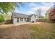Picture of the backyard with a small patio and a wooden fence that borders the yard at 3227 Grove Trl, Acworth, GA 30101