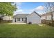 The home's private backyard features a well-maintained lawn, patio, and partial fencing at 3227 Grove Trl, Acworth, GA 30101
