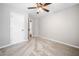 Bedroom with neutral carpet, ceiling fan, and white trim at 3227 Grove Trl, Acworth, GA 30101