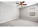 Bright bedroom with a ceiling fan, neutral paint, and carpet at 3227 Grove Trl, Acworth, GA 30101